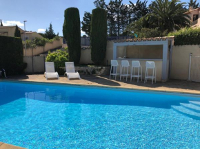 Holiday villa near Narbonne Plage fenced private swimming pool and view of a lake